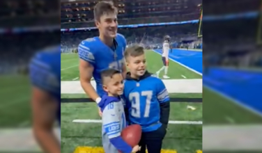 Catholic Elementary Student Gives a Rosary to NFL Star